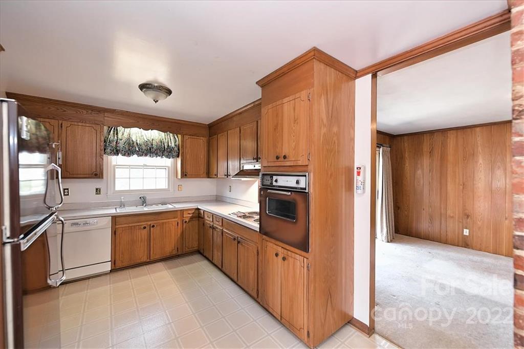 5714 Sharon Road Charlotte, NC 28210 - Photo 7 of 22 a kitchen with stainless steel appliances granite countertop a refrigerator and a sink