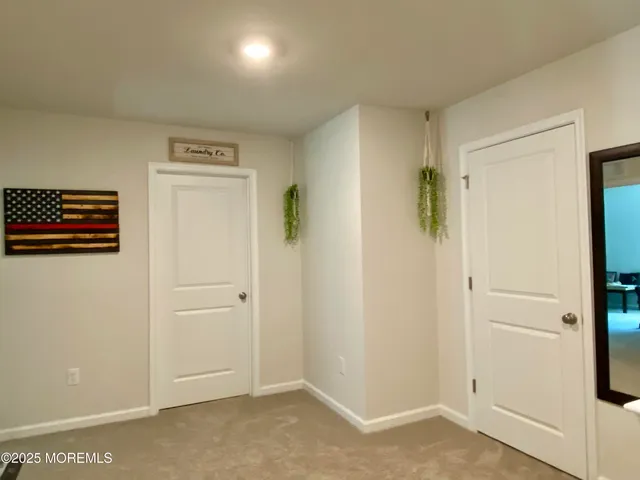 a view of a hallway with closet area
