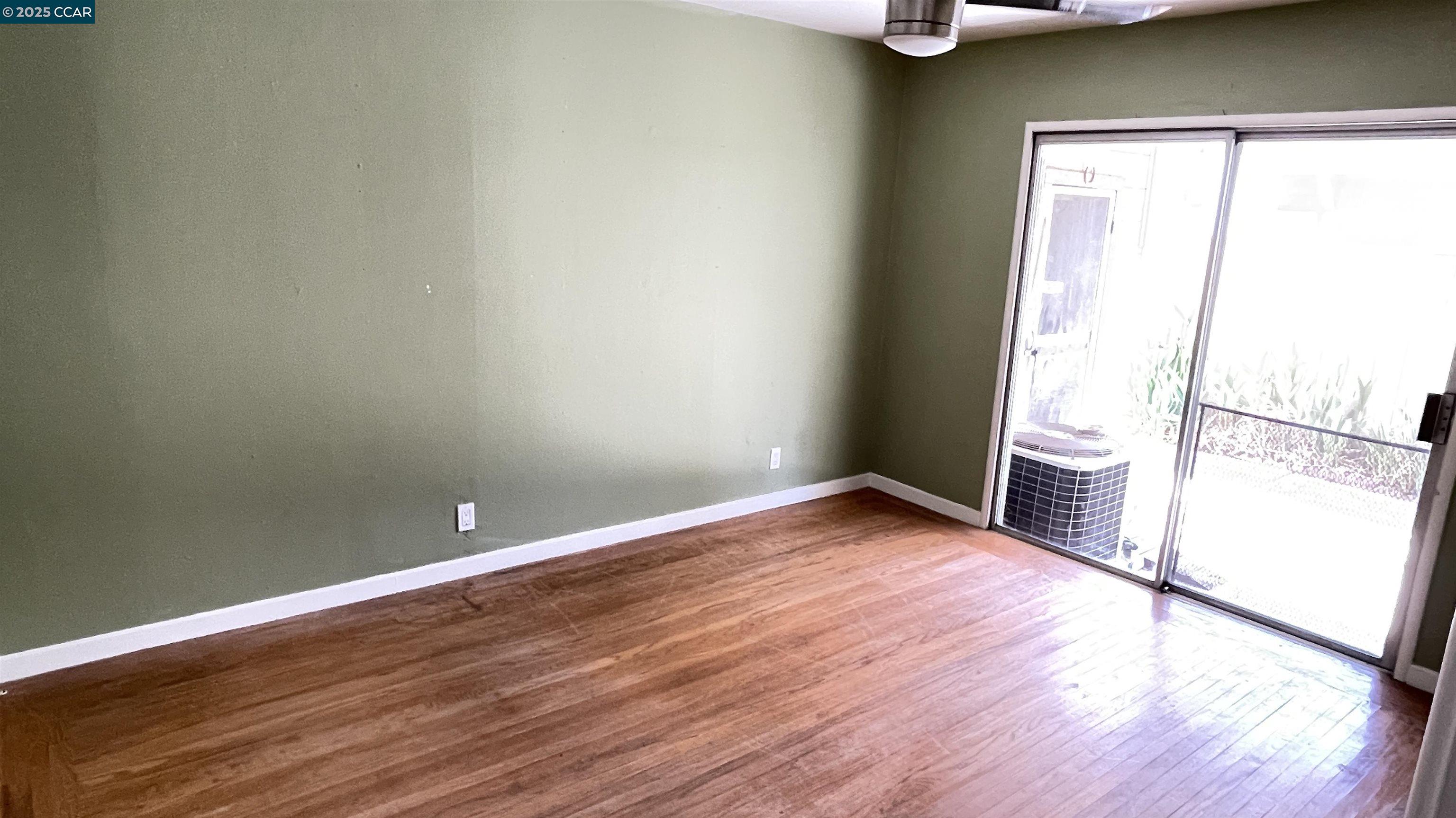 3655 Granzotto Drive Concord, CA 94519 - Photo 13 of 22 a view of a room with wooden floor and a window