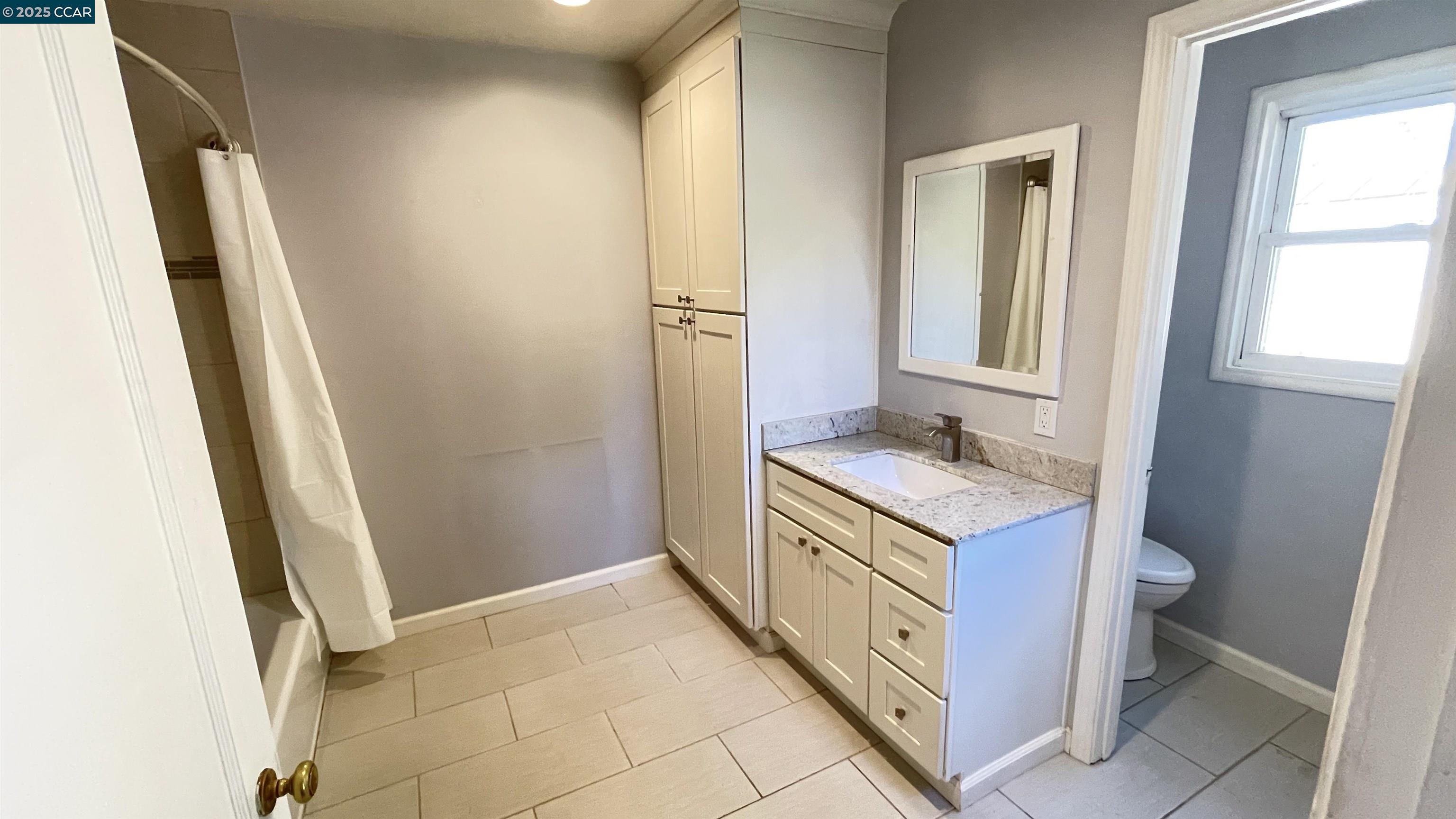 3655 Granzotto Drive Concord, CA 94519 - Photo 16 of 22 a bathroom with a granite countertop sink and a mirror