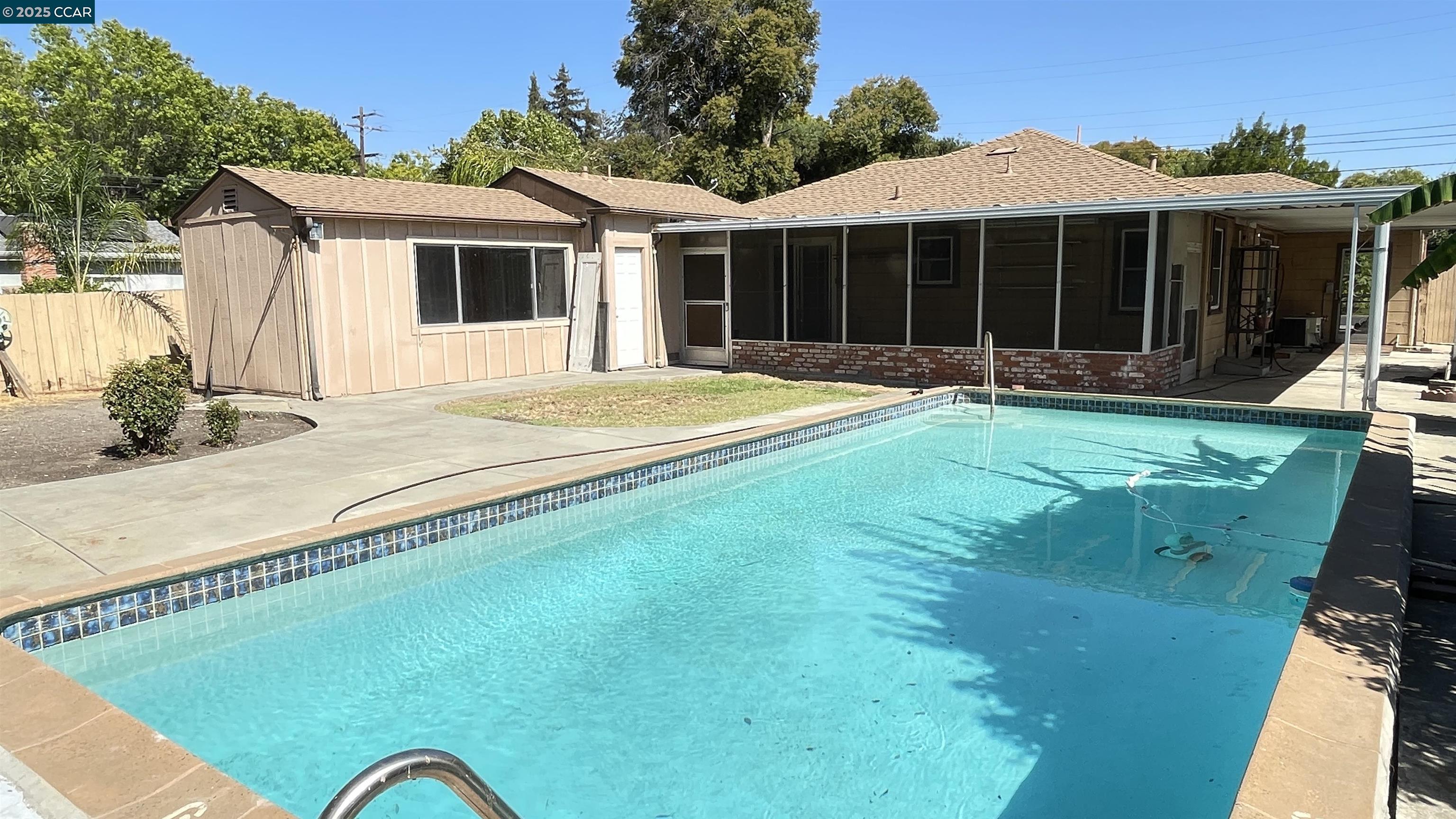 3655 Granzotto Drive Concord, CA 94519 - Photo 19 of 22 a view of a white house with a swimming pool and porch