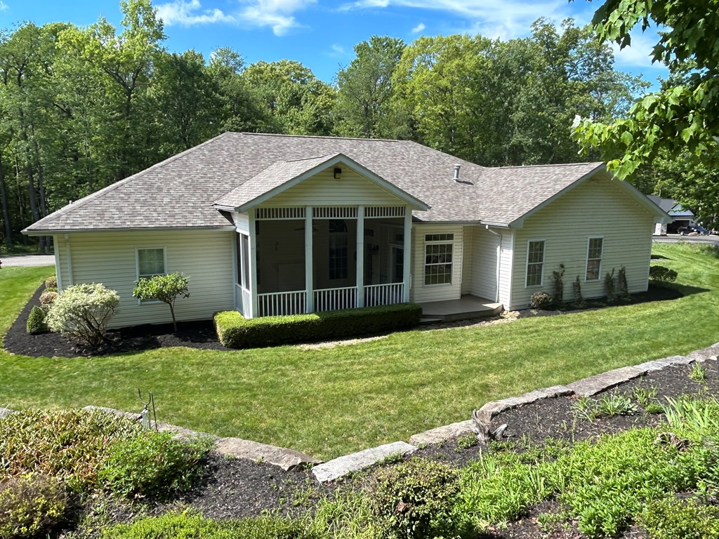 114 Oak Ridge Drive Clarion, PA 16214 - Photo 2 of 38 a view of a house with a yard and sitting area