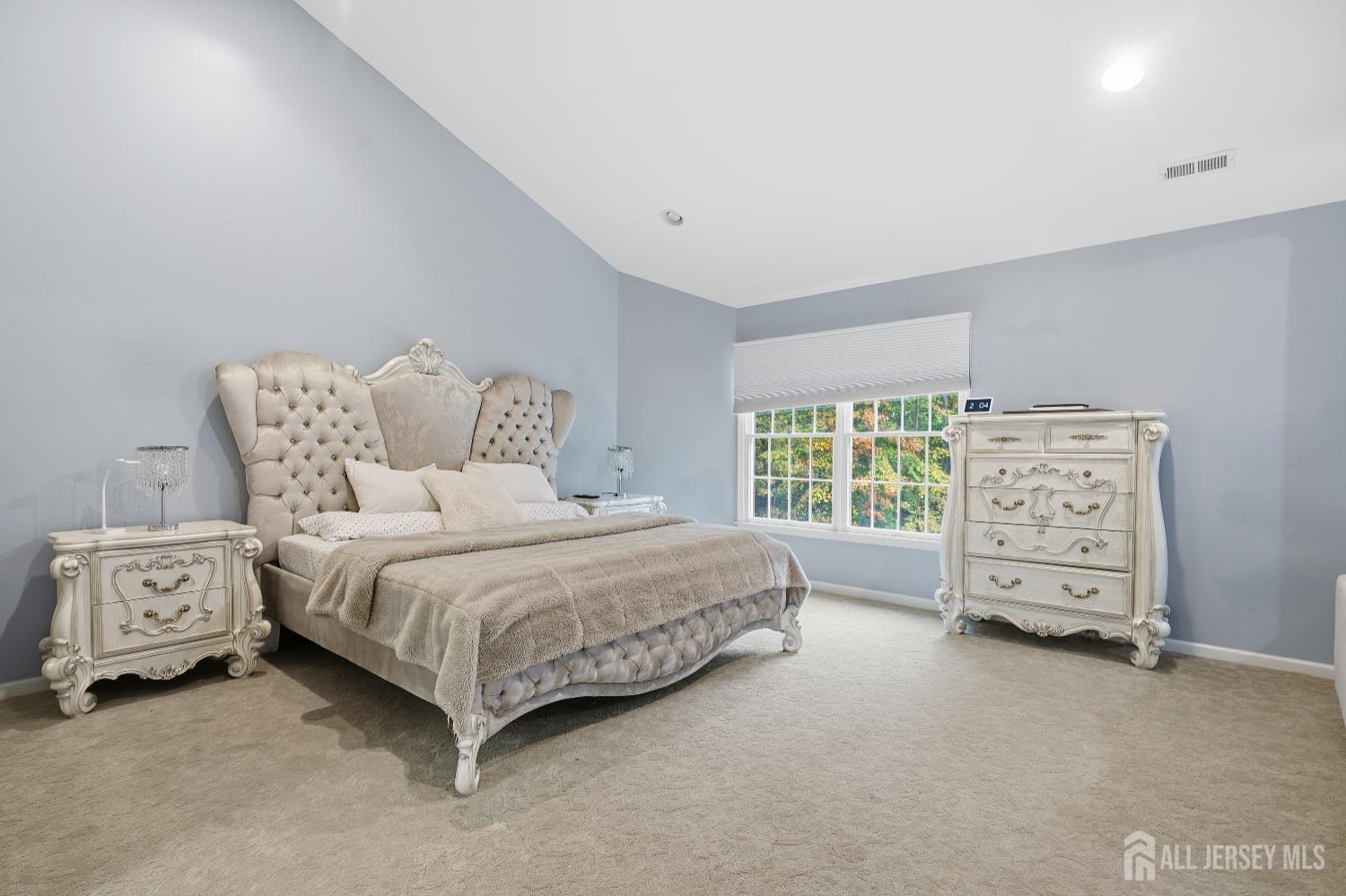 12 Risa Benjamin Way Freehold, NJ 07728 - Photo 15 of 32 a bedroom with a bed and a tv