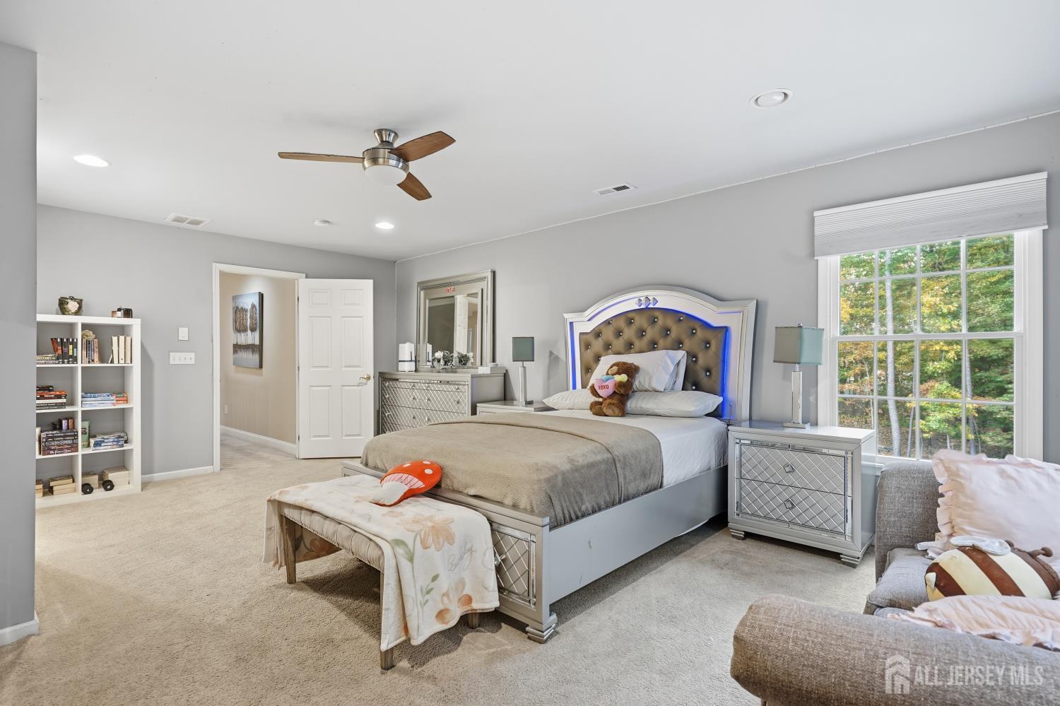 12 Risa Benjamin Way Freehold, NJ 07728 - Photo 17 of 32 a bedroom with a bed and a large window