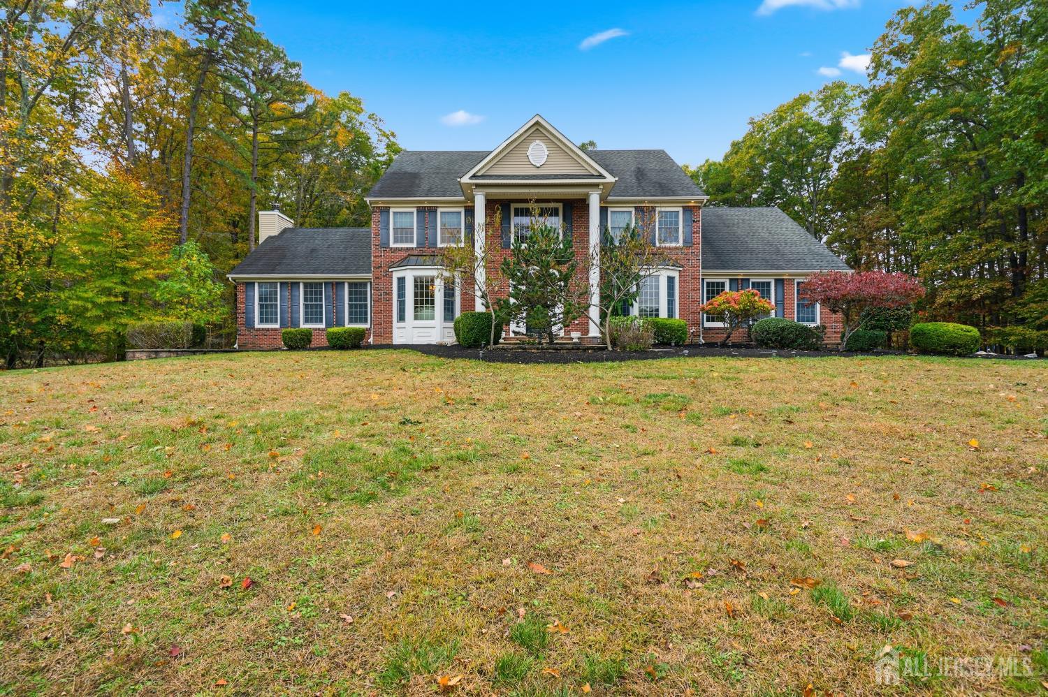 12 Risa Benjamin Way Freehold, NJ 07728 - Photo 2 of 32 a front view of a house with a garden