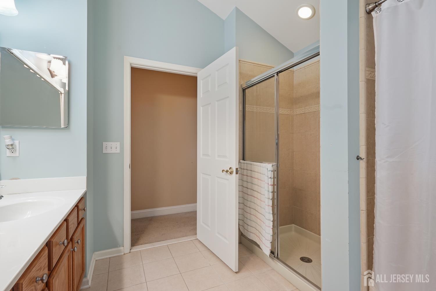 12 Risa Benjamin Way Freehold, NJ 07728 - Photo 23 of 32 a bathroom with a shower and a sink