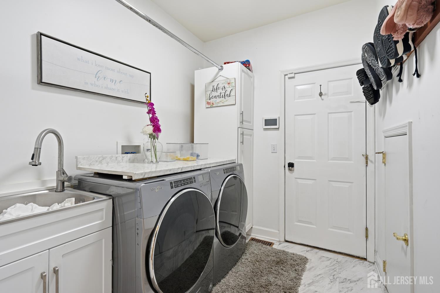 12 Risa Benjamin Way Freehold, NJ 07728 - Photo 27 of 32 a utility room with sink dryer and washer