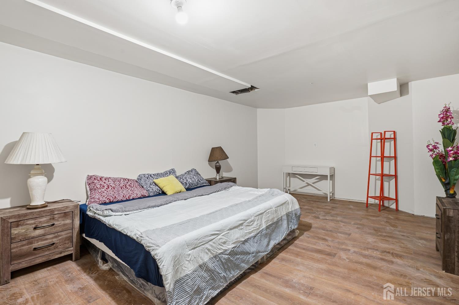 12 Risa Benjamin Way Freehold, NJ 07728 - Photo 30 of 32 a bedroom with a bed and a cabinets