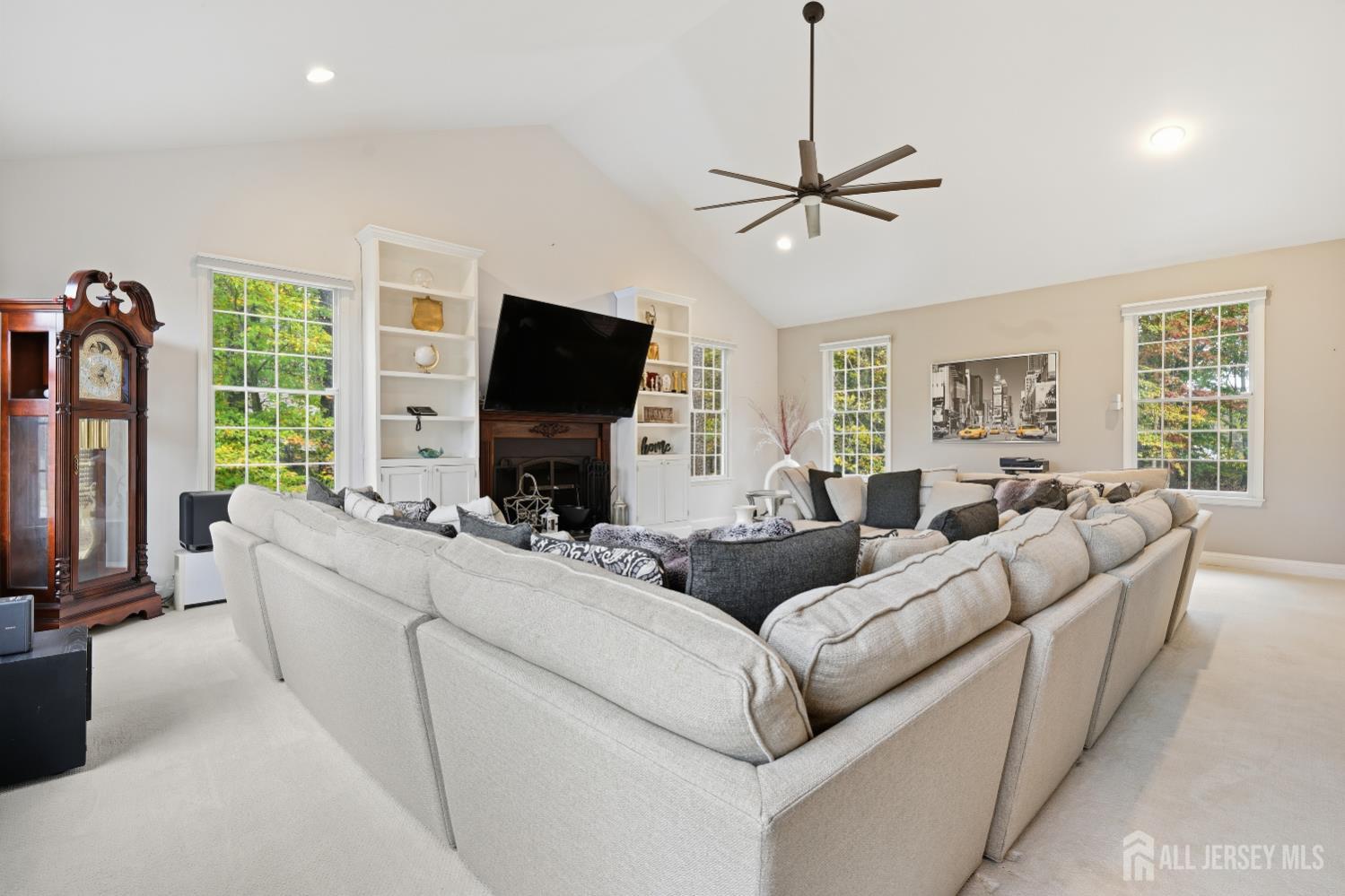 12 Risa Benjamin Way Freehold, NJ 07728 - Photo 8 of 32 a living room with furniture and a flat screen tv