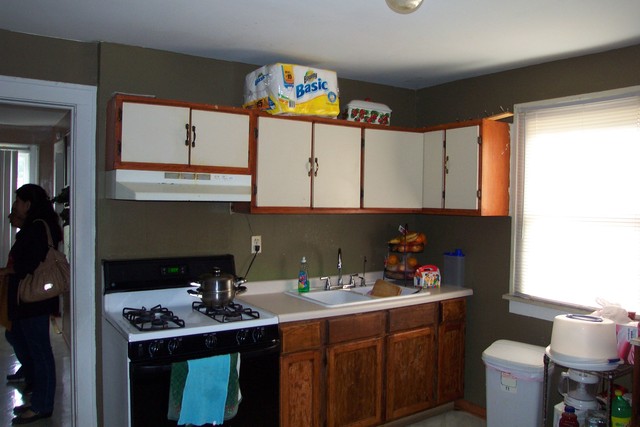 778 Spring Street Aurora, IL 60505 - Photo 11 of 16 a kitchen with stainless steel appliances a sink a stove a refrigerator and cabinets