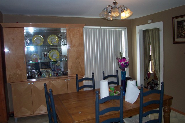 778 Spring Street Aurora, IL 60505 - Photo 4 of 16 a view of a dining room with furniture and chandelier