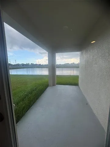 a view of a glass door and a yard