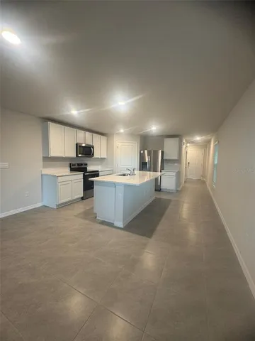a view of a kitchen with furniture and a kitchen