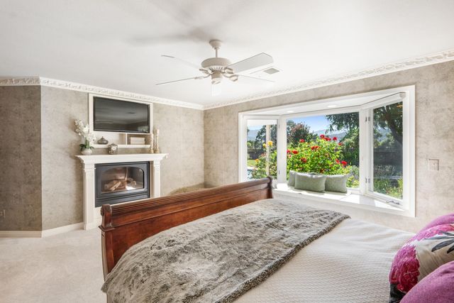 a living room with a flat screen tv and a fireplace