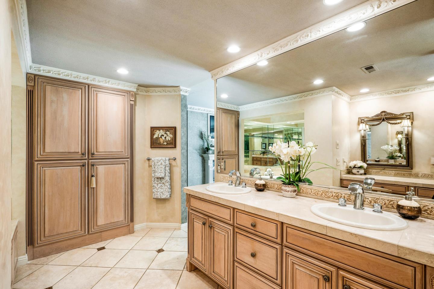 9230 Braquet Lane Gilroy, CA 95020 - Photo 19 of 49 a bathroom with a double vanity sink a mirror and a shower