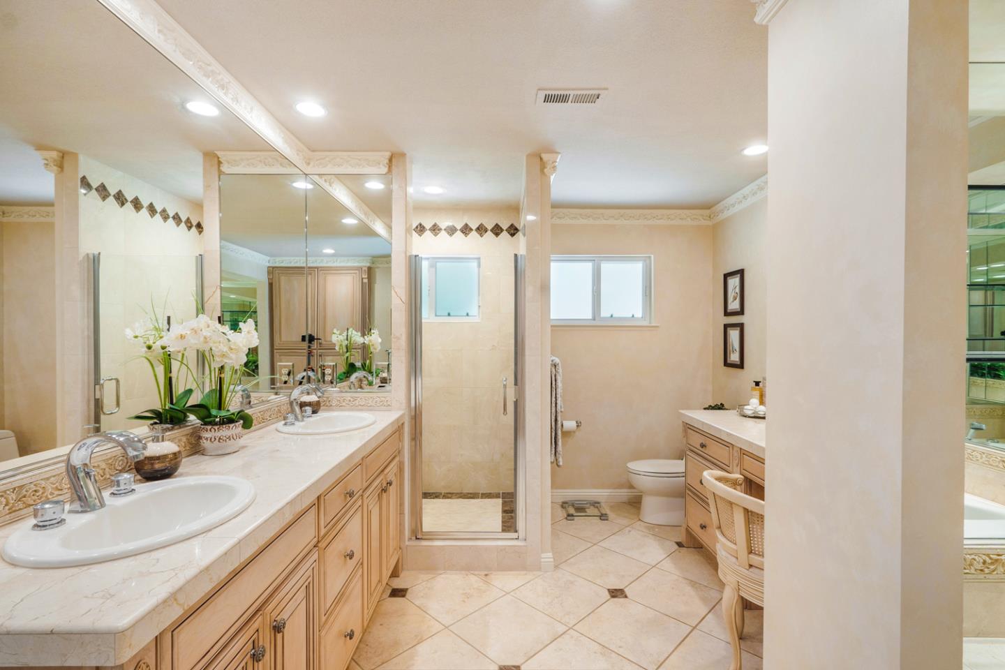 9230 Braquet Lane Gilroy, CA 95020 - Photo 20 of 49 a spacious bathroom with a double vanity sink mirror and toilet