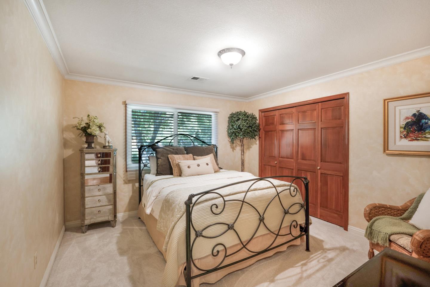 9230 Braquet Lane Gilroy, CA 95020 - Photo 23 of 49 a bedroom with a large bed and a window