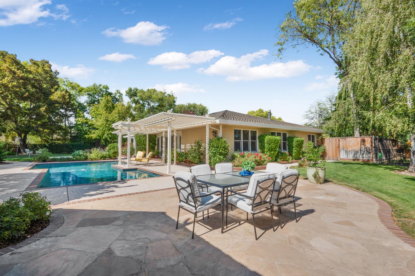 9230 Braquet Lane Gilroy, CA 95020 - Photo 28 of 49 a view of a patio with a dining table and chairs with a yard