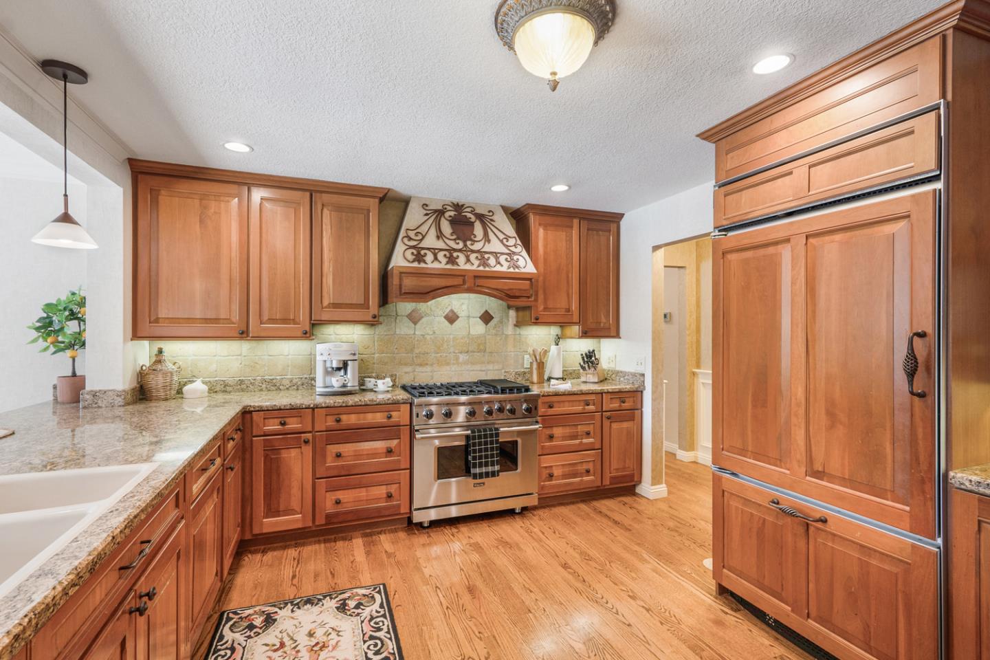 9230 Braquet Lane Gilroy, CA 95020 - Photo 6 of 49 a kitchen with stainless steel appliances granite countertop a stove and a refrigerator