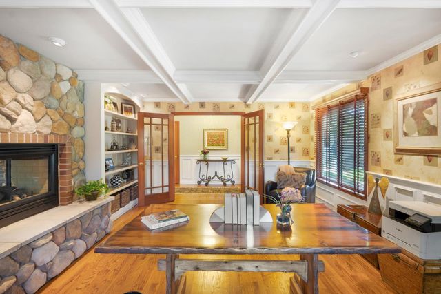 a dining room with large window