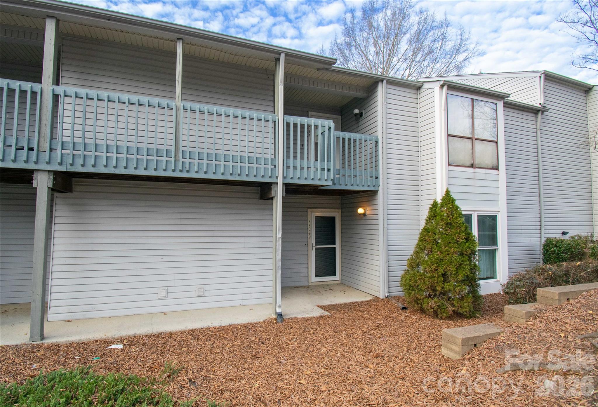 11042 Harrowfield Road Charlotte, NC 28226 - Photo 2 of 14 a front view of a house with garage