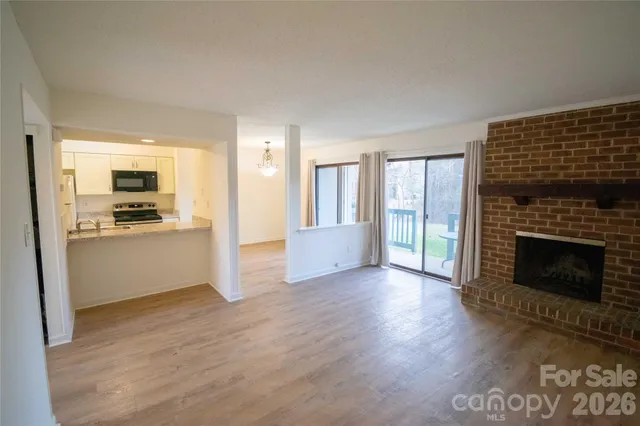 a view of a kitchen cabinets and wooden floor