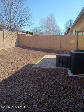 a view of backyard and entertaining space