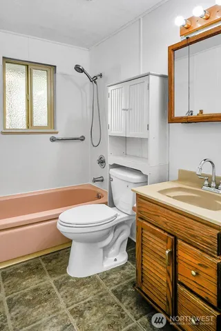 a view of backyard of house with green space