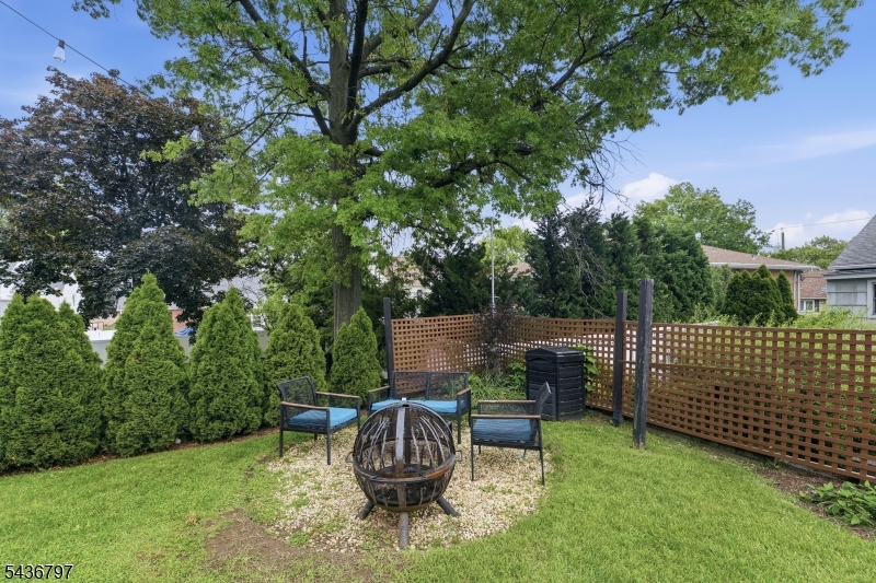 17 Arthur Drive Rutherford, NJ 07070 - Photo 36 of 45 a backyard of a house with table and chairs