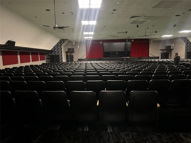 a kitchen with black stainless steel appliances a stove and a sink