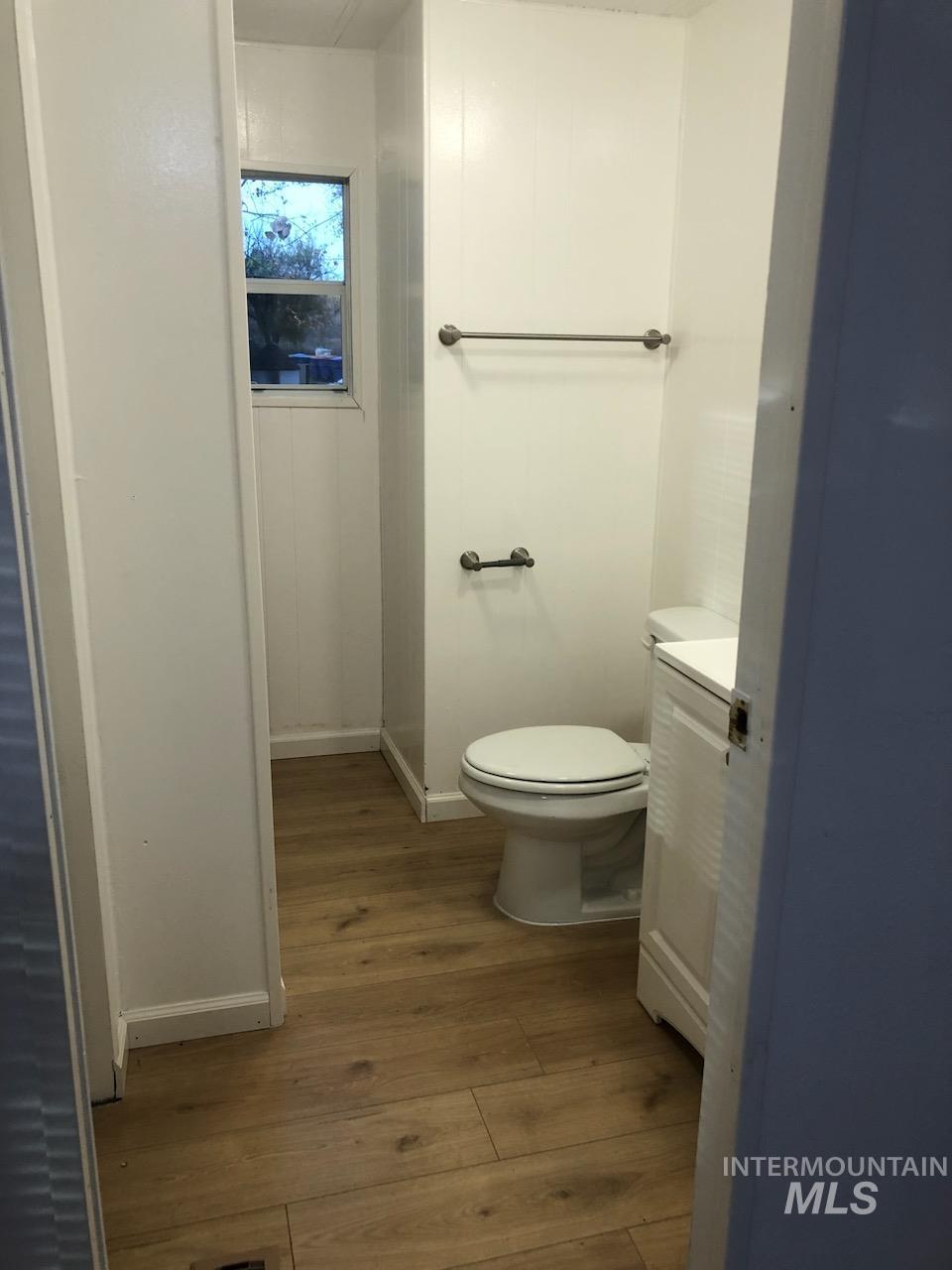 655 Dolson Lane Eagle, ID 83616 - Photo 20 of 23 Bathroom featuring dark wood-style floors and vanity