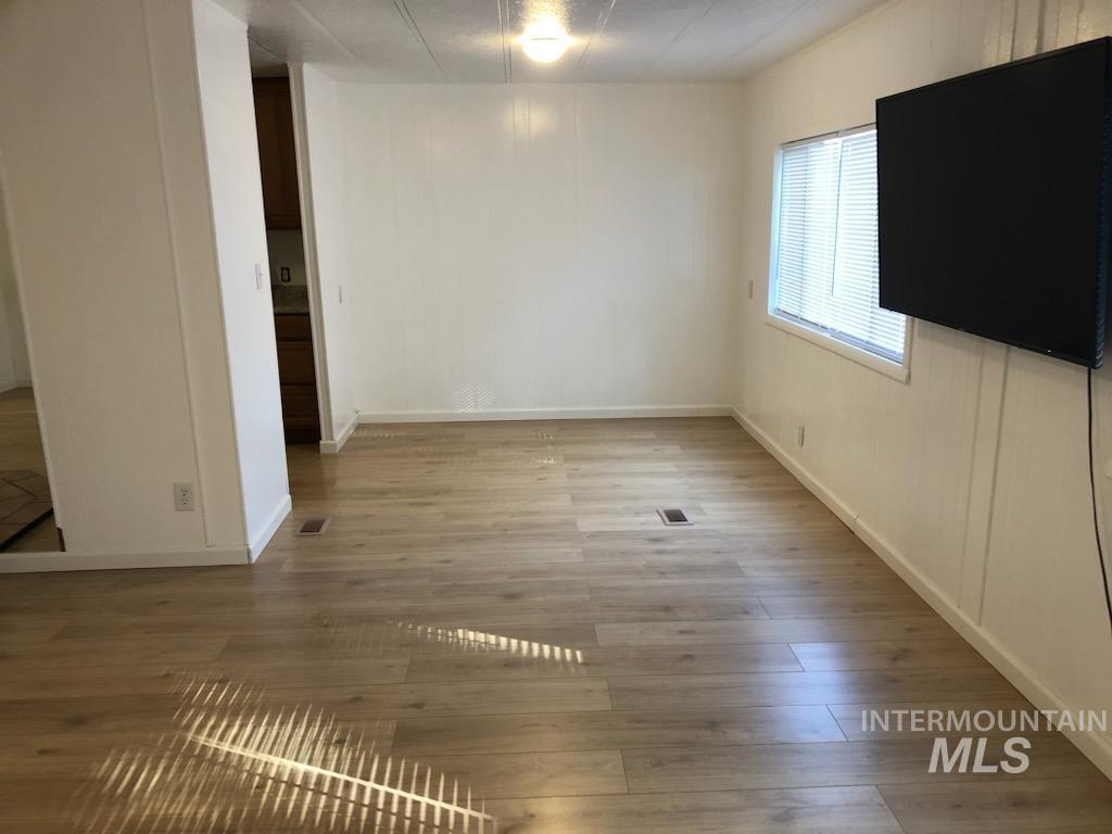 655 Dolson Lane Eagle, ID 83616 - Photo 4 of 23 Unfurnished dining area with light wood-type flooring