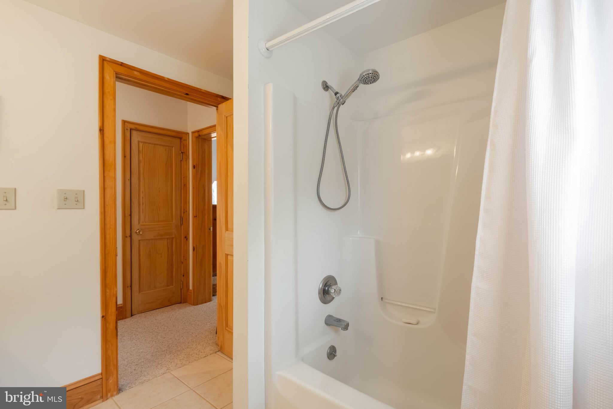 128 Bridgeview Lane Swanton, MD 21561 - Photo 27 of 70 a bathroom with a shower