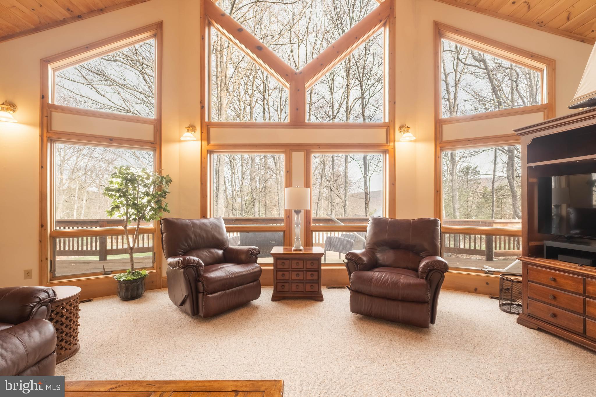 128 Bridgeview Lane Swanton, MD 21561 - Photo 3 of 70 a living room with furniture and floor to ceiling windows
