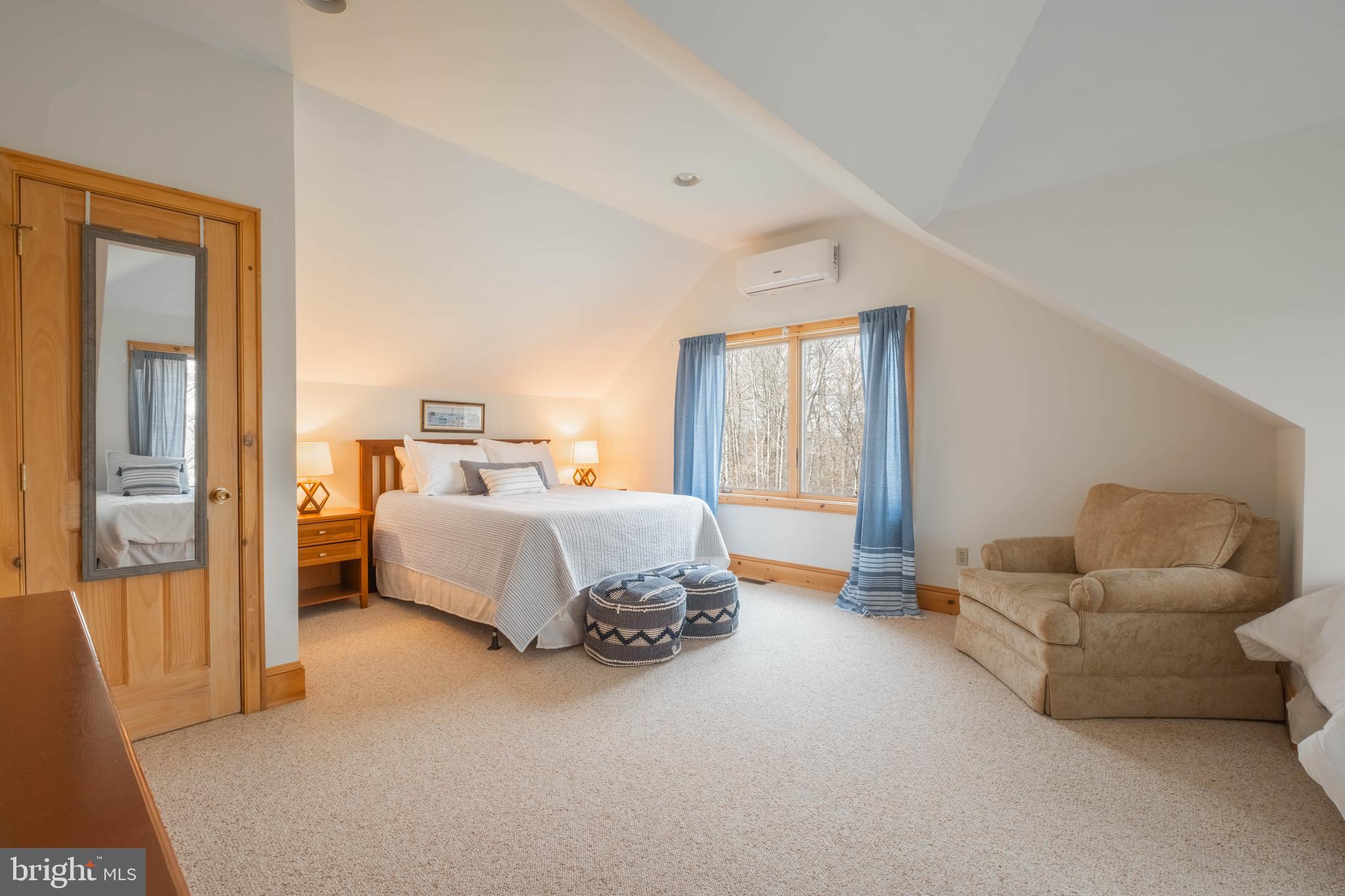 128 Bridgeview Lane Swanton, MD 21561 - Photo 31 of 70 a spacious bedroom with a bed and a couch