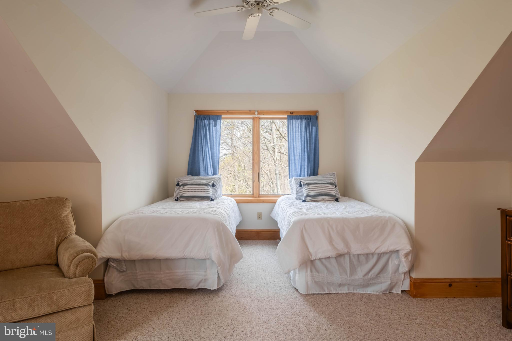 128 Bridgeview Lane Swanton, MD 21561 - Photo 32 of 70 a bedroom with two beds and a chandelier