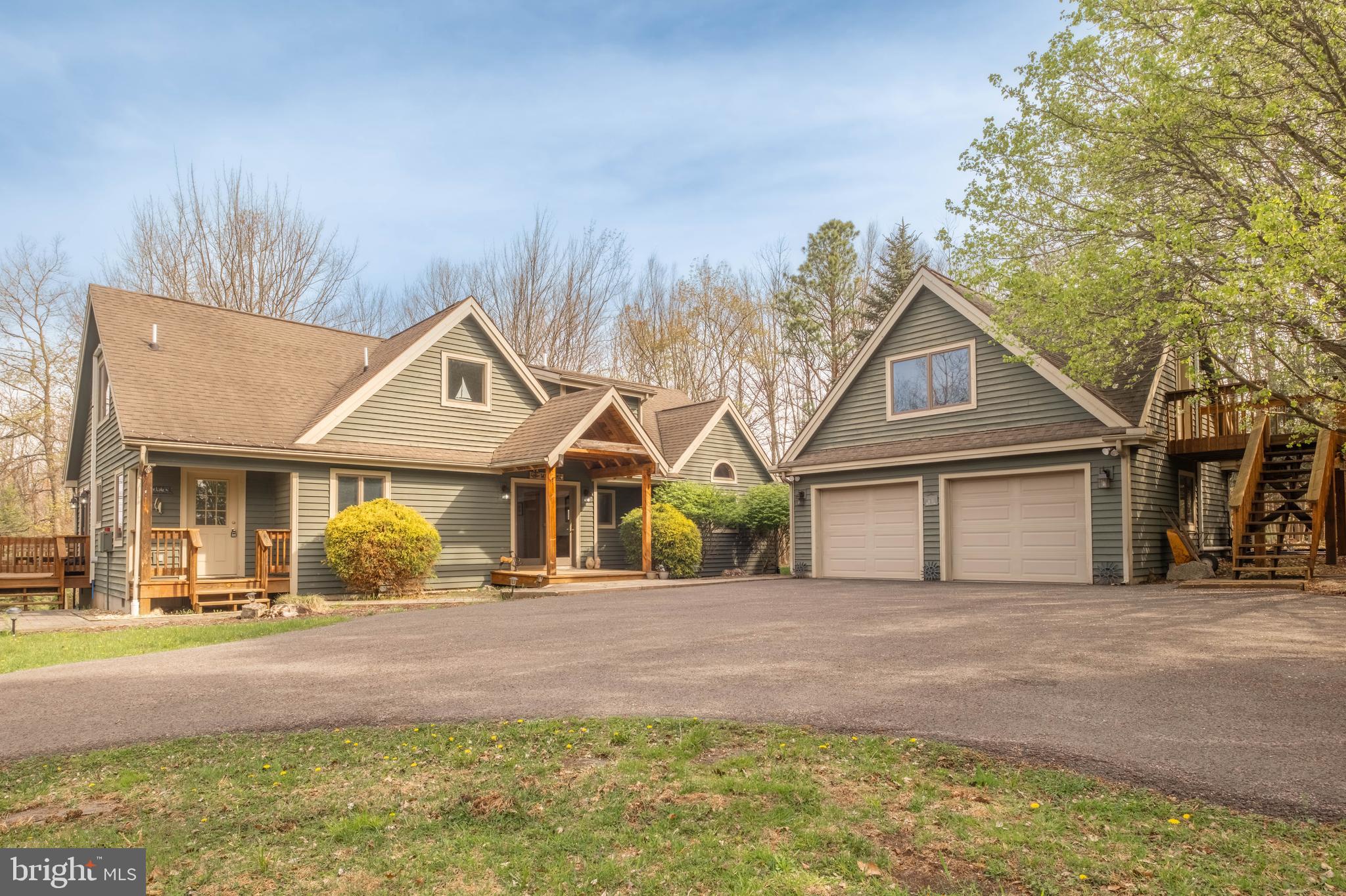 128 Bridgeview Lane Swanton, MD 21561 - Photo 36 of 70 a front view of a house with a yard and garage
