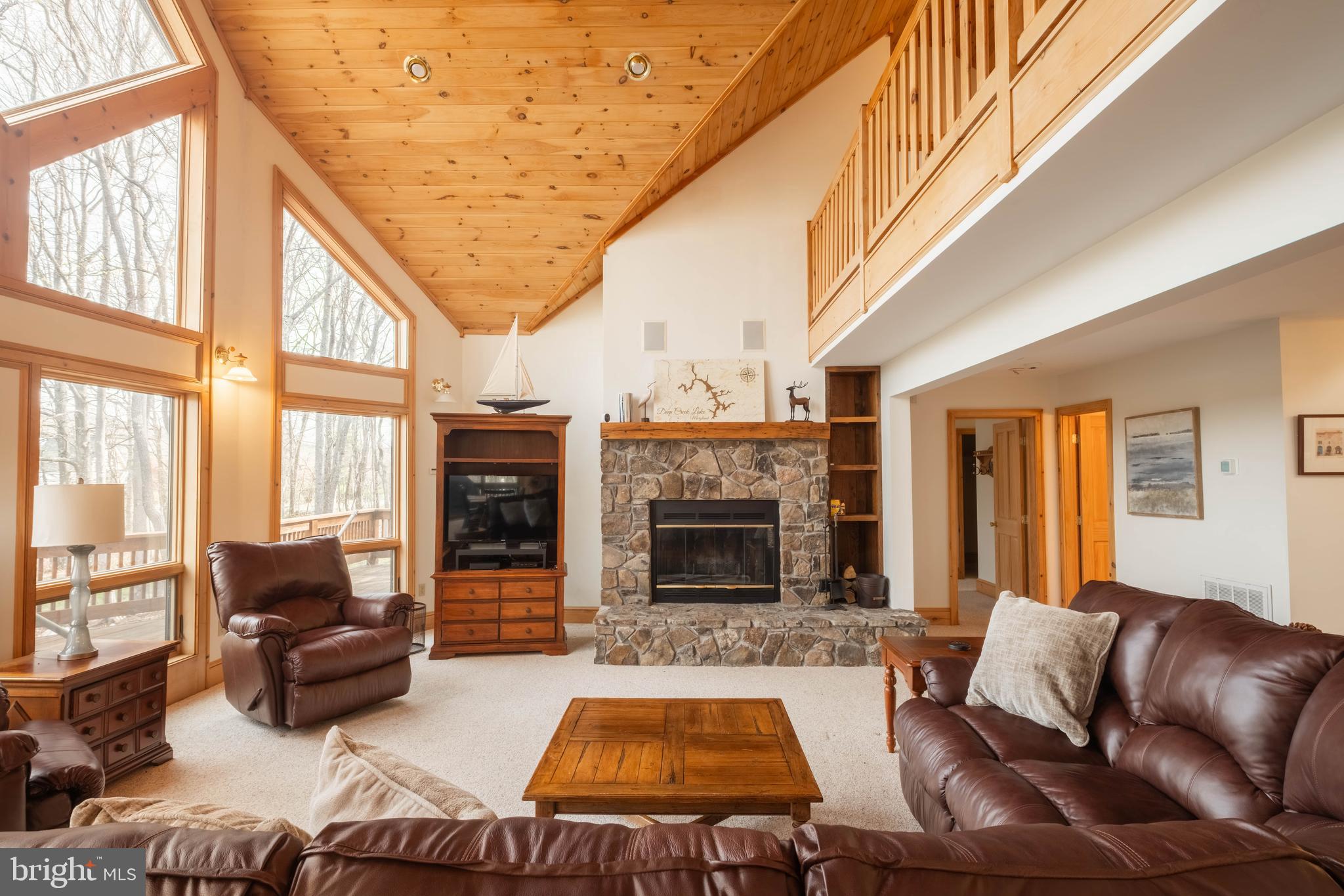 128 Bridgeview Lane Swanton, MD 21561 - Photo 4 of 70 a living room with furniture fireplace and flat screen tv