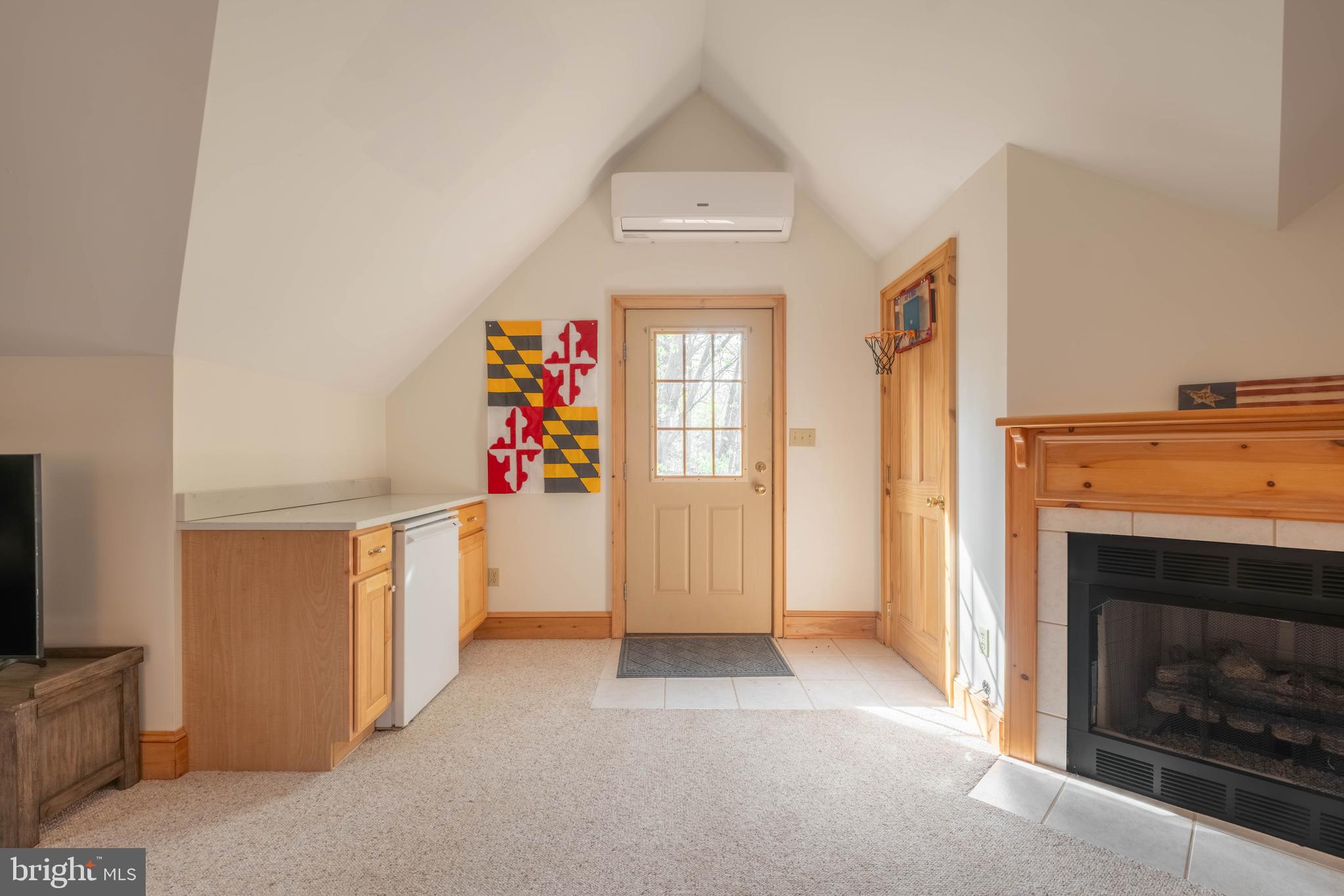 128 Bridgeview Lane Swanton, MD 21561 - Photo 44 of 70 a view of a livingroom with an empty space and a fireplace