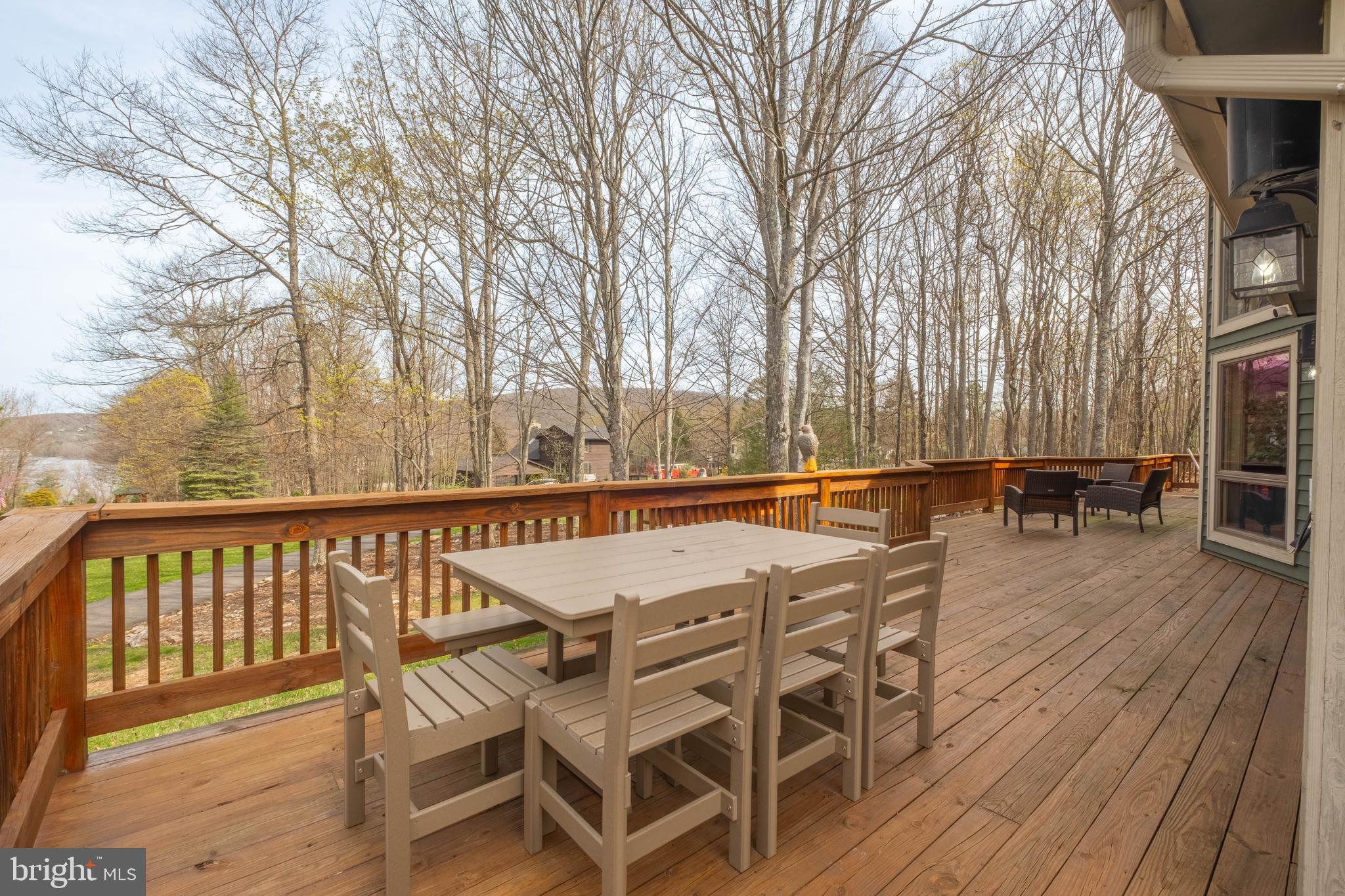 128 Bridgeview Lane Swanton, MD 21561 - Photo 48 of 70 a view of balcony with wooden floor and outdoor seating