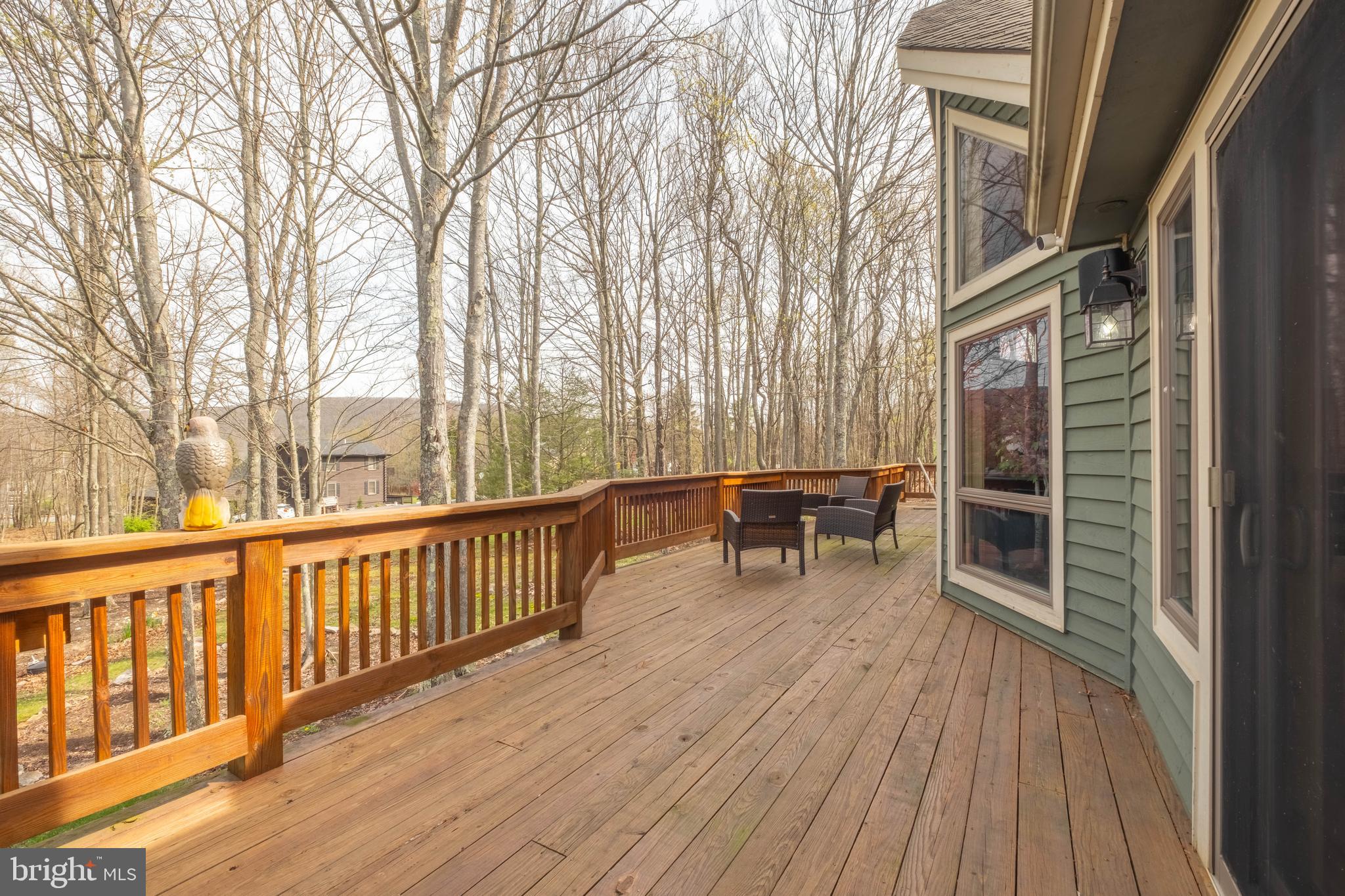 128 Bridgeview Lane Swanton, MD 21561 - Photo 50 of 70 a view of a house with wooden deck and furniture