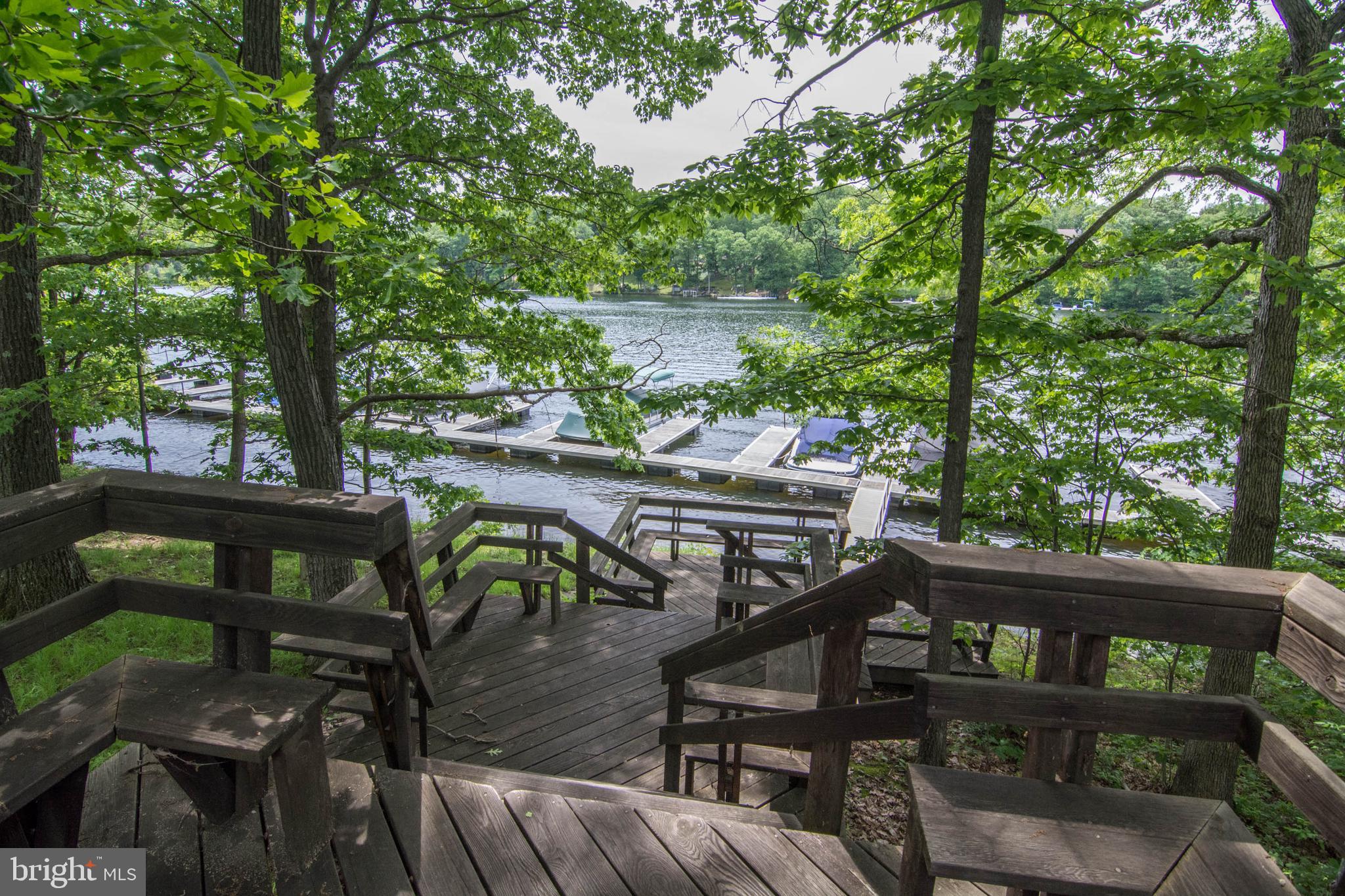 128 Bridgeview Lane Swanton, MD 21561 - Photo 66 of 70 a view of balcony with wooden floor and outdoor seating
