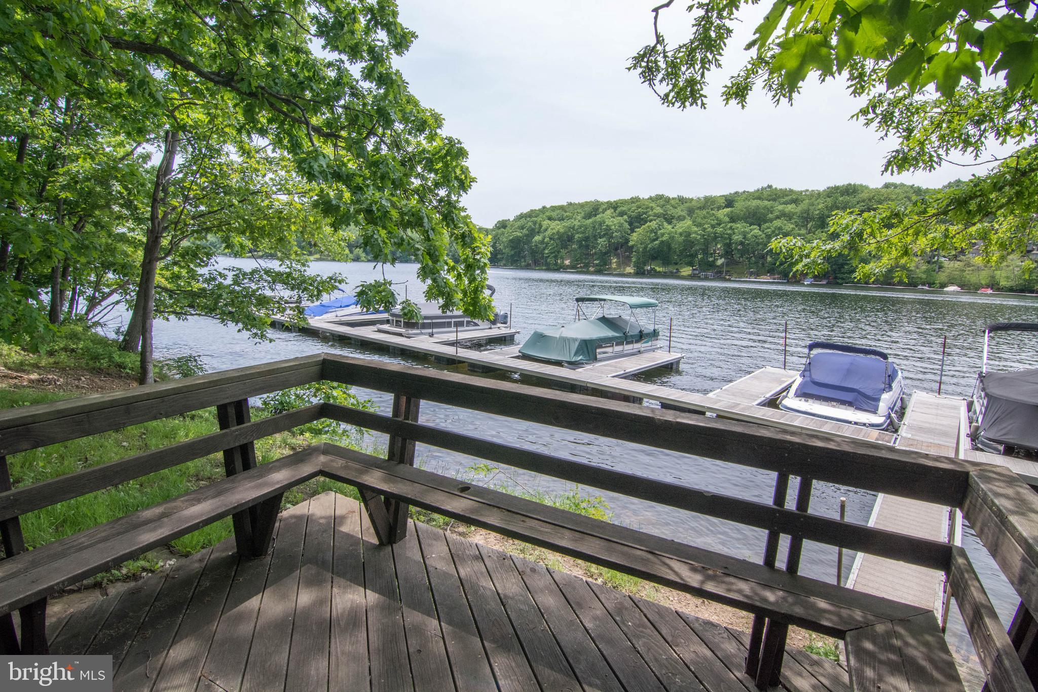 128 Bridgeview Lane Swanton, MD 21561 - Photo 67 of 70 a view of a balcony with two chairs and a table