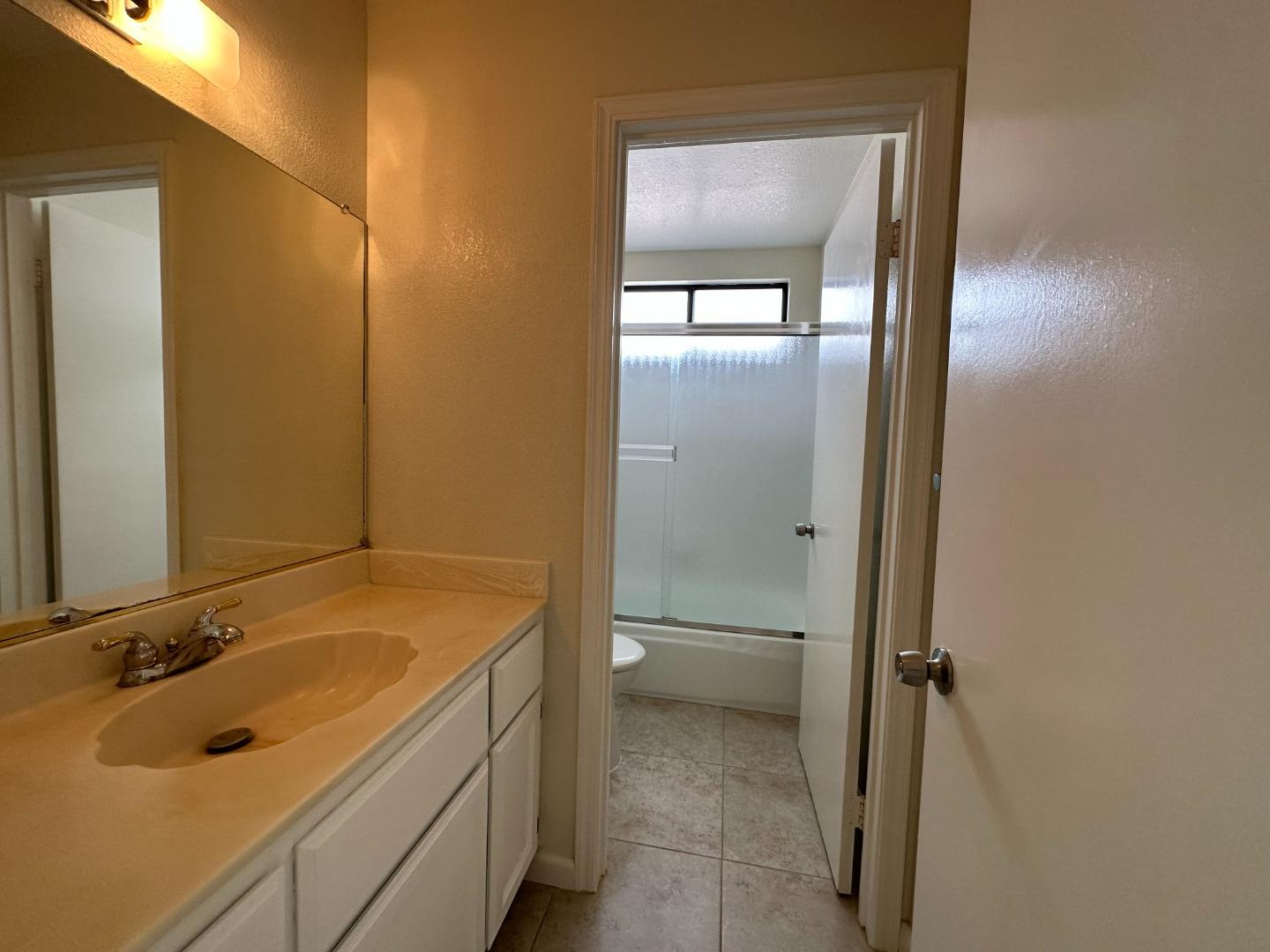645 Kirby Common Fremont, CA 94539 - Photo 18 of 39 a bathroom with a sink and a tub