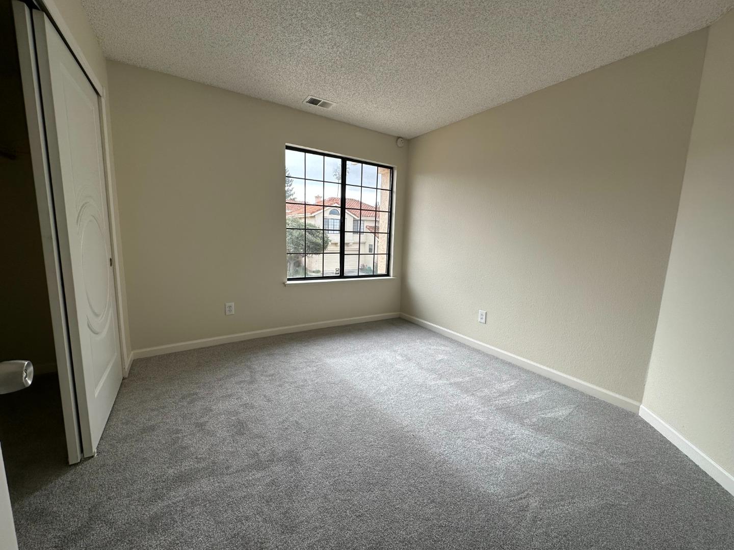 645 Kirby Common Fremont, CA 94539 - Photo 19 of 39 an empty room with windows