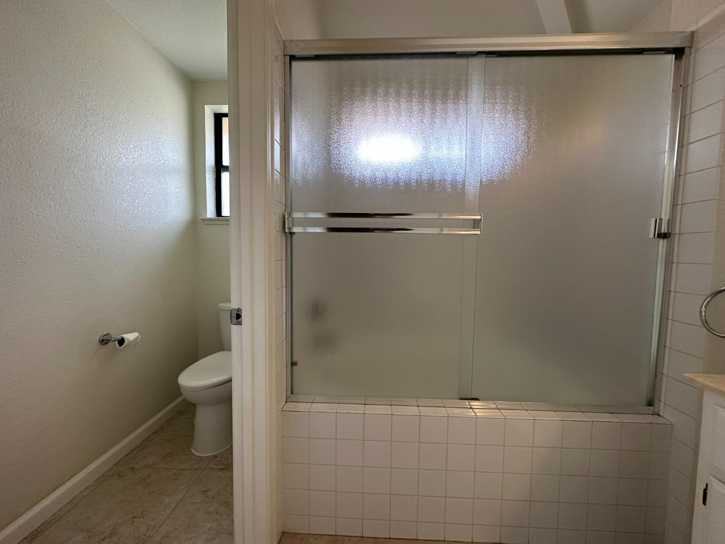 645 Kirby Common Fremont, CA 94539 - Photo 27 of 39 a bathroom with a granite countertop shower and a toilet