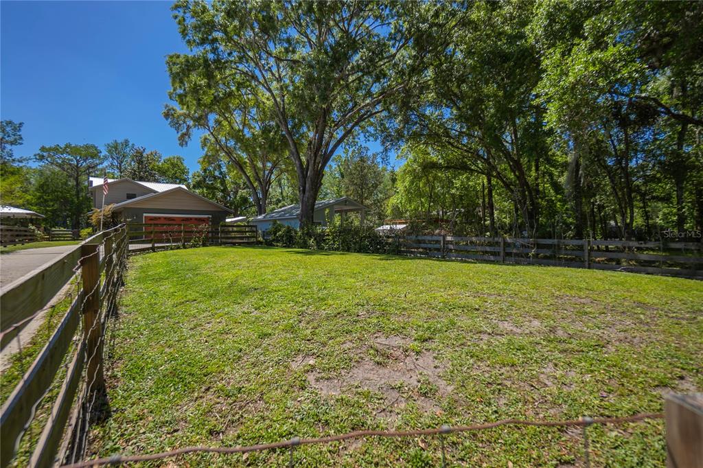 28330 Peterson Camp Road Brooksville, FL 34601 - Photo 2 of 60 a view of yard with swimming pool and green space