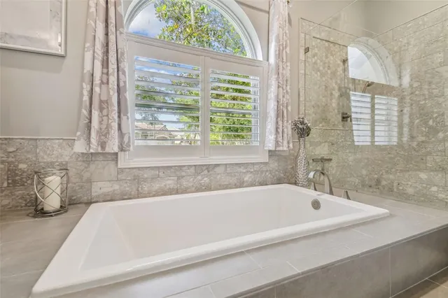 a bedroom with a bed and a dresser in it