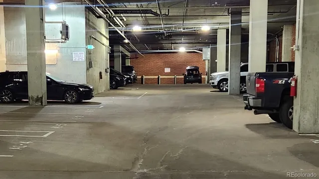 a view of parking garage with cars