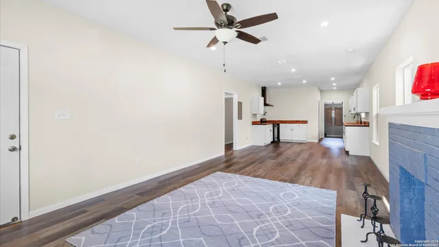 a view of a livingroom with a furniture and wooden floor